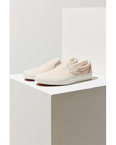 cream slip on vans