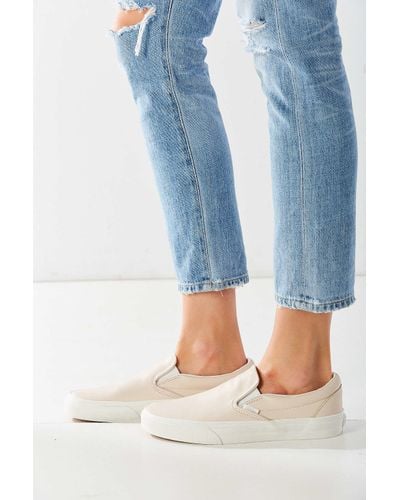 cream slip on vans