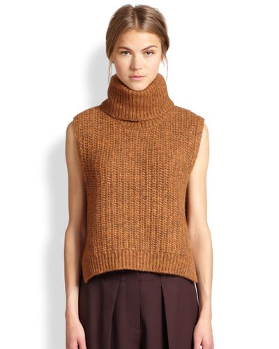 orange sleeveless turtleneck