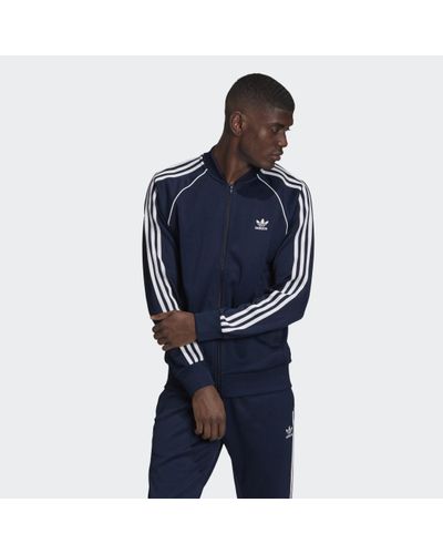 Originals Hombre | Chaqueta Adicolor Classics Primeblue SST Scarlet / White  | Adidas · Elya Events