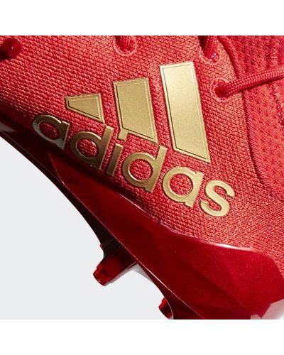 red spike adidas cleats