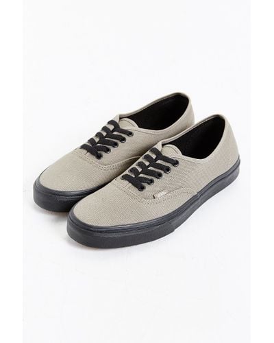 gray vans black sole