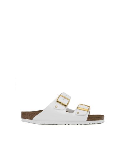 white birkenstocks gold buckle