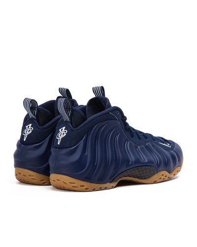 navy blue nike foams