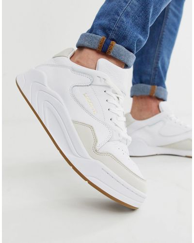 lacoste court slam on feet