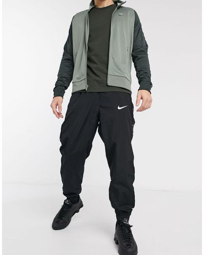 nike air cuffed woven joggers in black