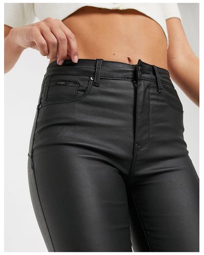 Stradivarius Denim Push Up Coated Jeans in Black | Lyst