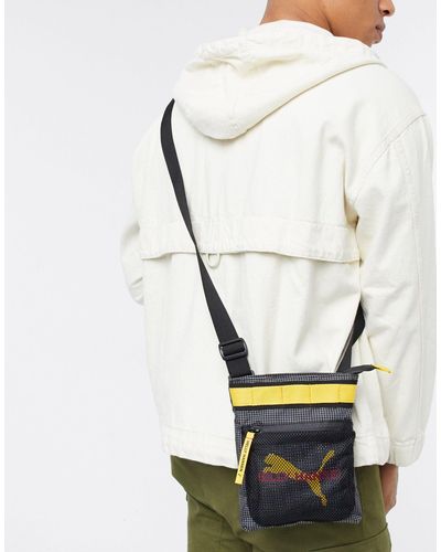 puma x helly hansen bolsa