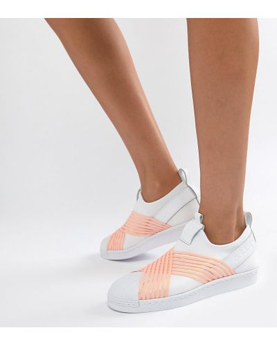tenis adidas prata e branco