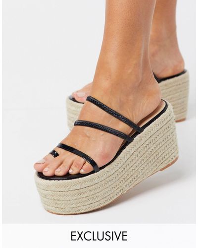Alpargatas negras con plataforma plana y tira para el dedo melanie  exclusivas SIMMI Shoes de color Negro | Lyst