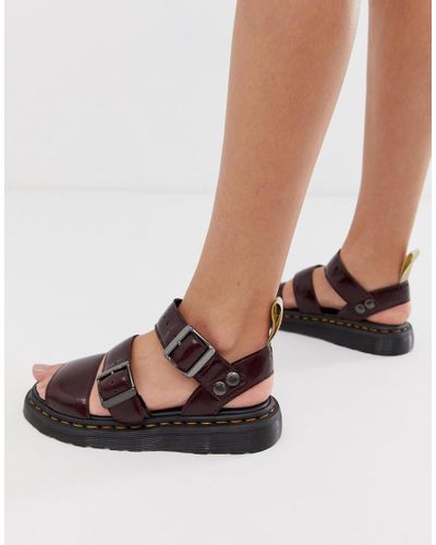 dr martens vegan gryphon strap sandals in black