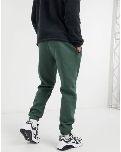 nike club casual fit cuffed sweatpants in khaki