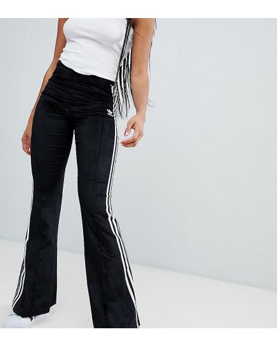 Pantalones campana de adidas para mujer | FASHIOLA.es