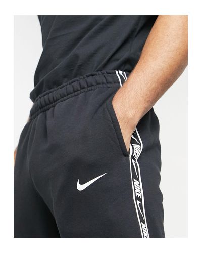 nike repeat tape track pants Off 66% - www.loverethymno.com