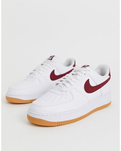 Zapatillas de deporte con logo rojo y suela de goma Air Force 1 Nike de  Tejido sintético de color Azul para hombre | Lyst