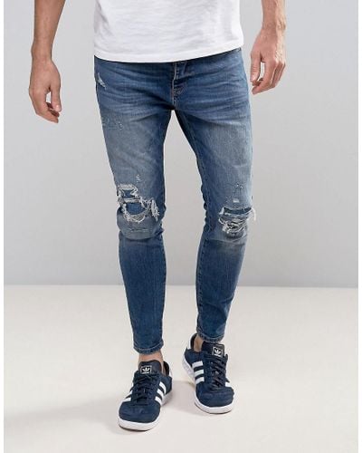 Pull&Bear Denim Skinny Carrot Fit Jeans In Mid Wash Blue for Men - Lyst