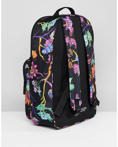 black backpack with flowers