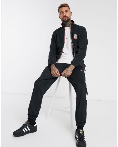 adidas originals adiplore polar fleece jacket in black