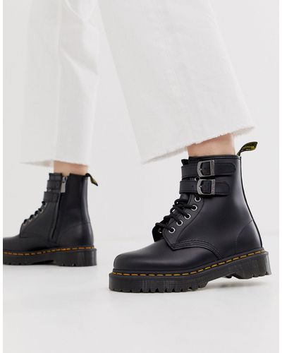 Dr. Martens Leer Laarzen Met Dikke Zool En Gesp Van Zwart Leer in het Zwart  - Lyst