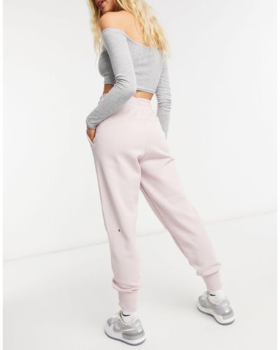 pink nike tech pants