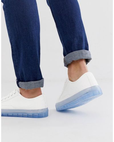 white sneakers blue sole