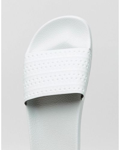 mint green adidas sliders