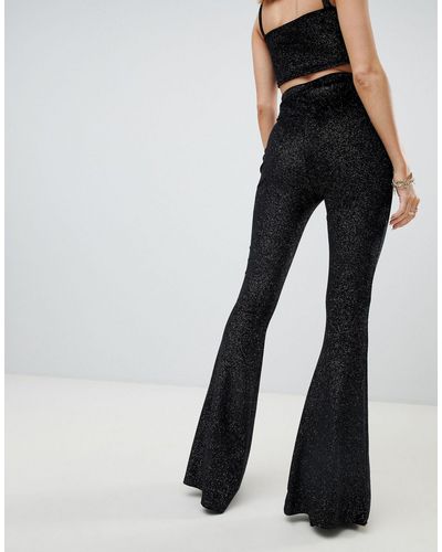 Pantaloni a zampa nero glitter coordinatiFashionkilla in Materiale  sintetico di colore Nero | Lyst