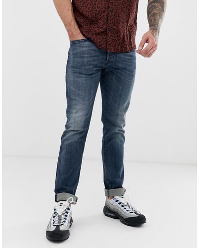 DIESEL Denim Buster Regular Slim Tapered Fit Jeans In 084as Mid Wash in  Blue for Men | Lyst