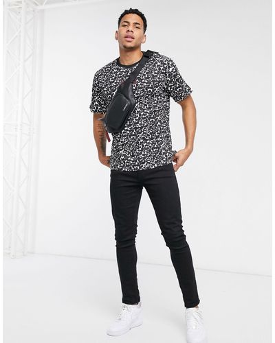 T-shirt décontracté avec imprimé fleurs sur l'ensemble Coton Calvin Klein  pour homme en coloris Noir - Lyst