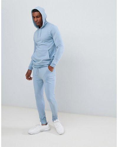 Tuta azzurra con felpa attillata con cappuccio e joggers super skinnyASOS  in Cotone da Uomo colore Blu | Lyst