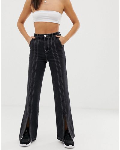 Jeans a zampa lunghi con spacco sul davanti e cuciture nere e bianche a  contrastoASOS in Denim di colore Nero | Lyst