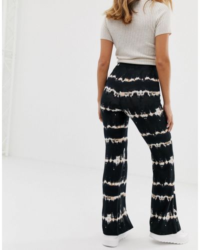 Bershka Synthetisch Tie-dye Flare-broek | Lyst NL