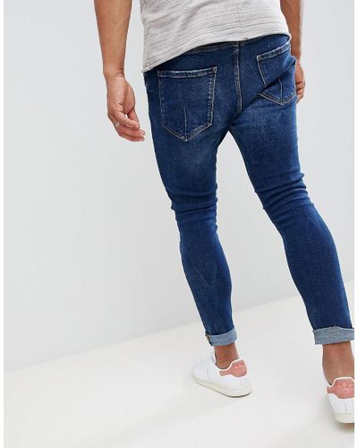 Bershka Denim Super Skinny Jeans With Rips In Dark Blue for Men | Lyst