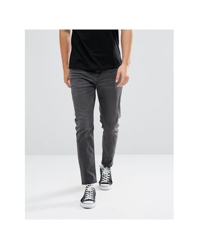 mens black tapered jeans