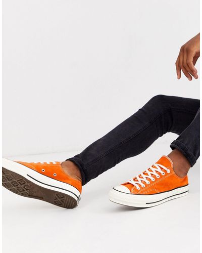 orange chuck taylors low top