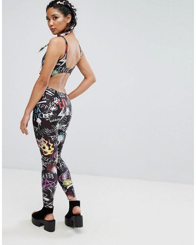 Jaded London Synthetic Festival Cut Out Jumpsuit In Graffiti Print in Black  - Lyst