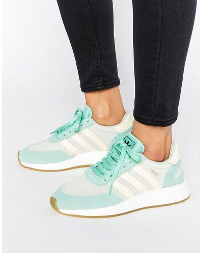 mint green adidas trainers