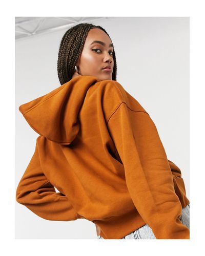 nike mini swoosh oversized joggers in tawny brown