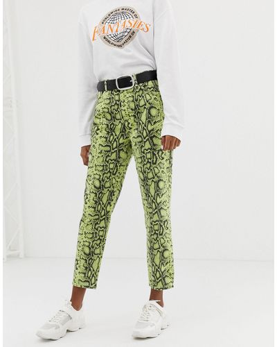 Pantaloni con stampa effetto pelle di serpenteBershka in Denim di colore  Verde | Lyst