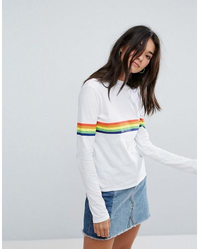 grey shirt with rainbow stripe