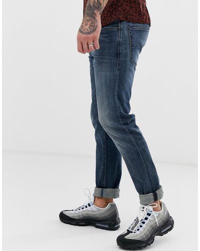 DIESEL Denim Buster Regular Slim Tapered Fit Jeans In 084as Mid Wash in  Blue for Men | Lyst