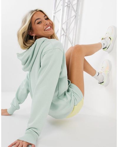 Sudadera extragrande con capucha y logo pequeño metalizado en verde pastel  Nike de color Verde | Lyst