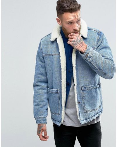Giacca di jeans lavaggio blu con fodera in pelo effetto pecoraASOS in Denim  da Uomo colore Blu | Lyst