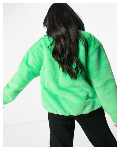 Nike Faux Fur Oversized Swoosh Jacket in Green - Lyst