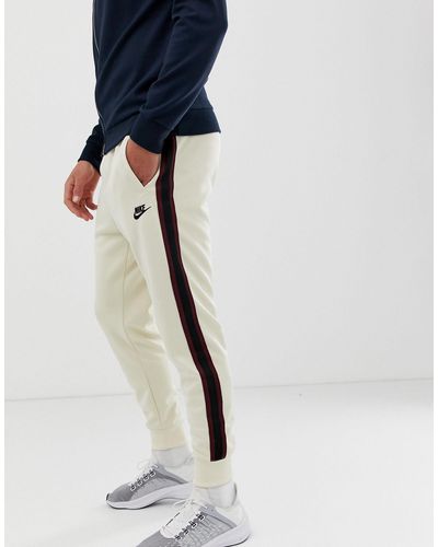 Nike Katoen Tribute - Joggingbroek in het Naturel voor heren - Lyst