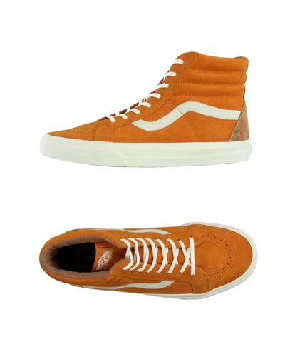 orange and white high top vans