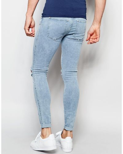 super skinny jeans black ripped knees 