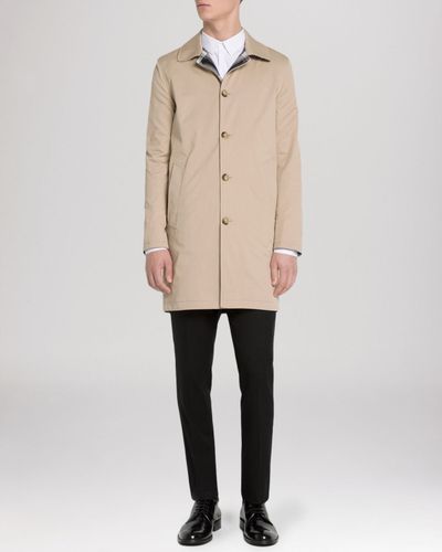 beige rain mac