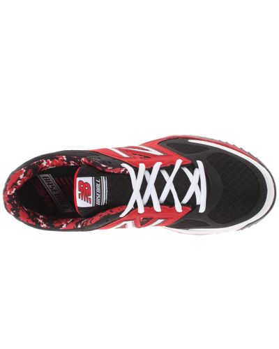 red and black new balance turfs