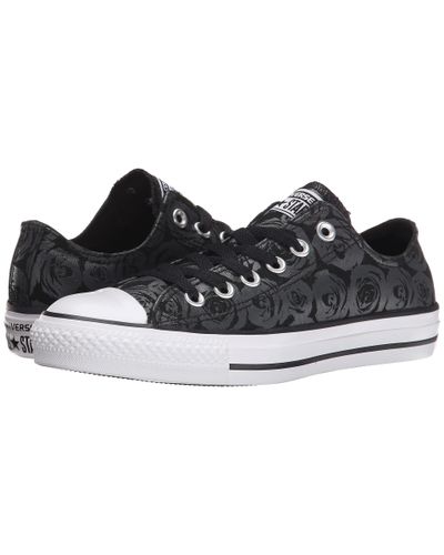 black converse with roses